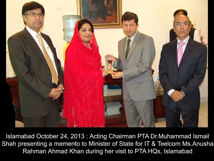Acting Chairman of PTA presenting mementos to Minister of Telecom